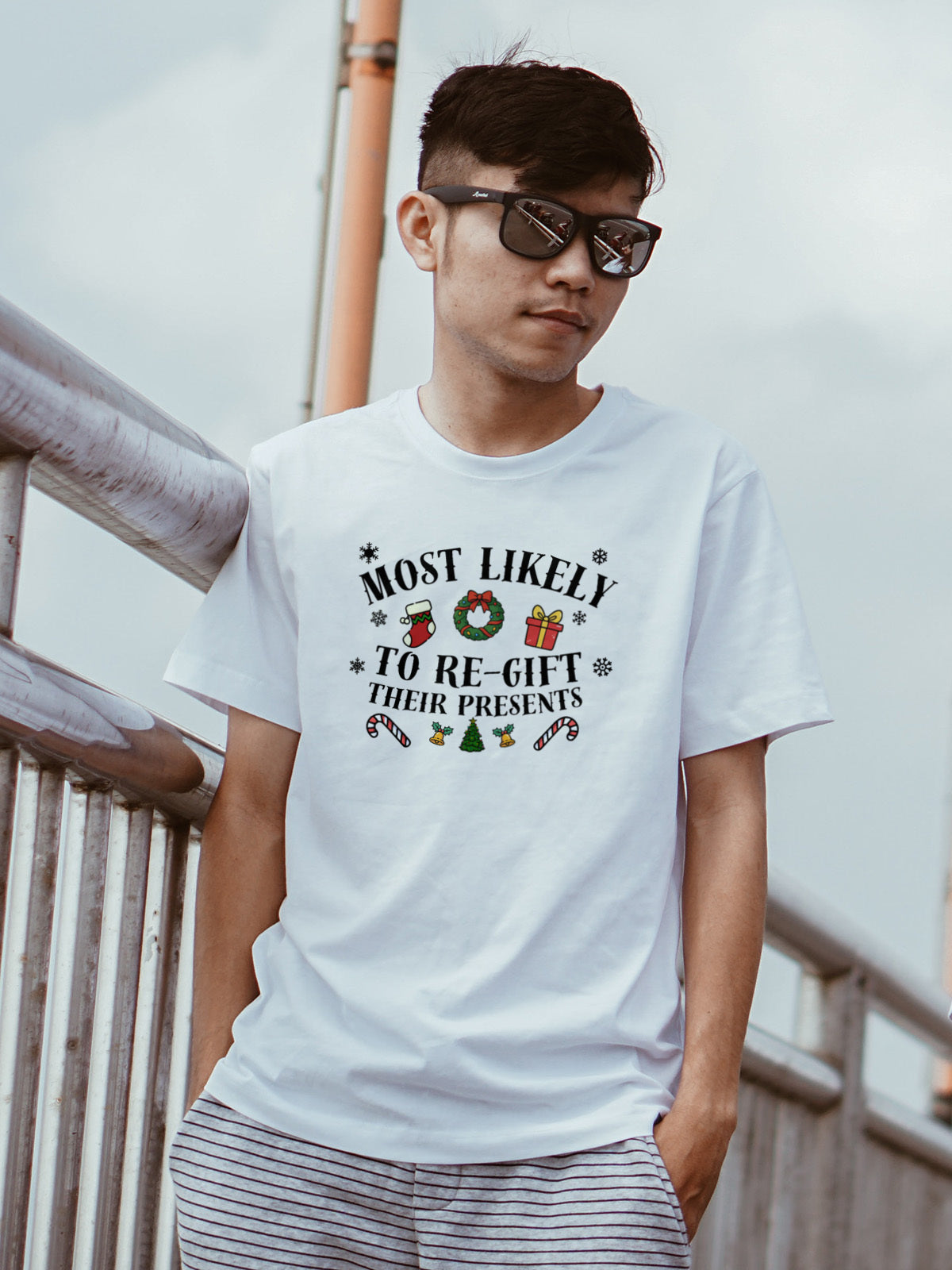 Most Likely to Regift Their Presents Christmas Tee — Playful Unisex Holiday Shirt with Cute Festive Graphics | LAHall Artworks