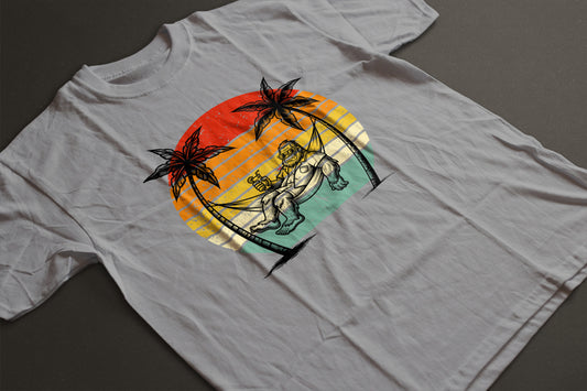 Bigfoot Beach Sunset Graphic Tee – Funny Sasquatch Vacation Shirt | Vintage Retro Summer T-Shirt | LAHall Artworks Bigfoot Collection
